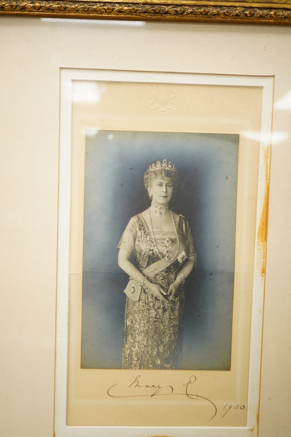 A pair of framed photographs of King George V and Queen Mary, signed by each on the Mount beneath the photograph, and both dated 1930, contained within a gilt frame, overall dimensions 50.5 x 61cm